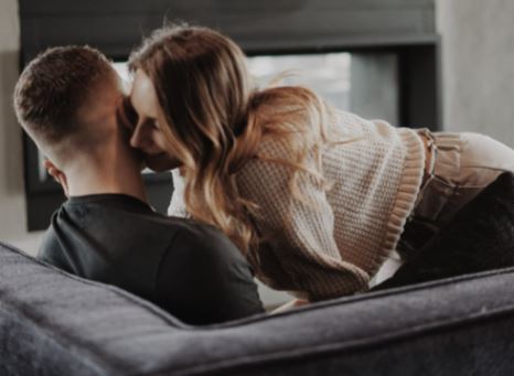 ASMR woman whispering in man's ear