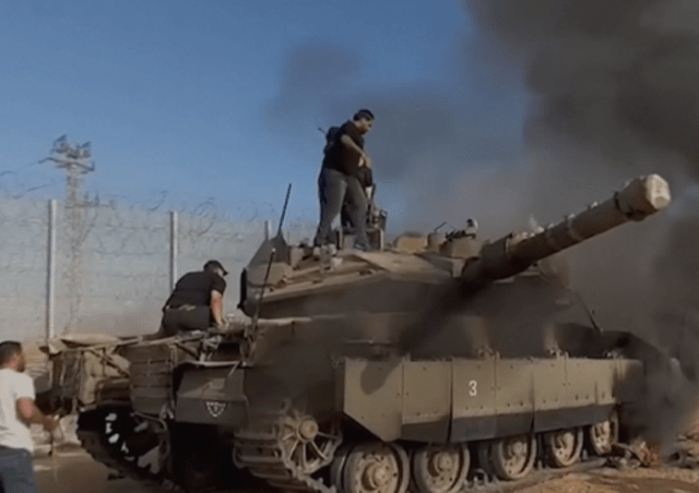 Picture of an Israel tank with Hamas soldiers.