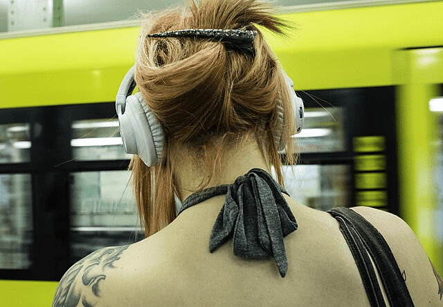Back view of girl wearing headphones